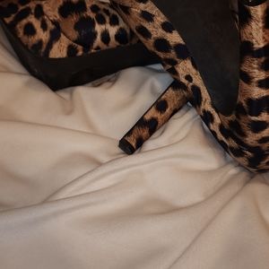 MK cheetah heels size 9.